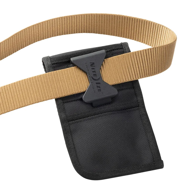 Nite Ize Clip Pock-Its XL Utility Holster in black fabric featuring a black plastic clip with Nite Ize Innovative Utility text, shown attached to a tan webbing belt.