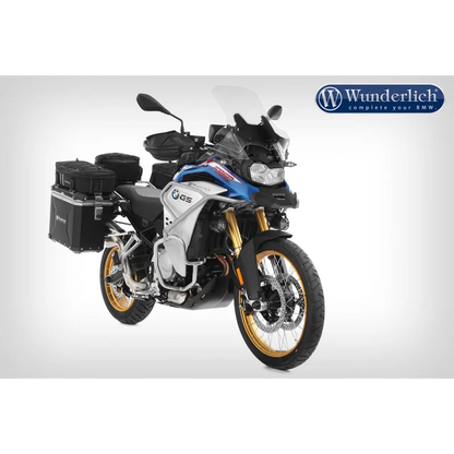 Motorcycle with luggage and Wunderlich logo on a white background