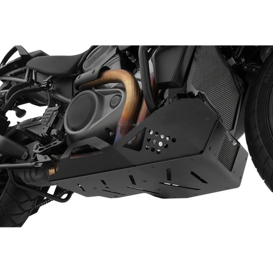 HD PAN America Protection SkidPlate matte black angular design with vent slots and mesh grill, mounted on Pan America motorcycle, lower side view with exhaust pipe visible.