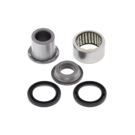Rear Shock Bearing Kit Lower (5063) with silver steel needle roller bearing, flanged sleeve, spacer, and two black rubber seals arranged on white background.