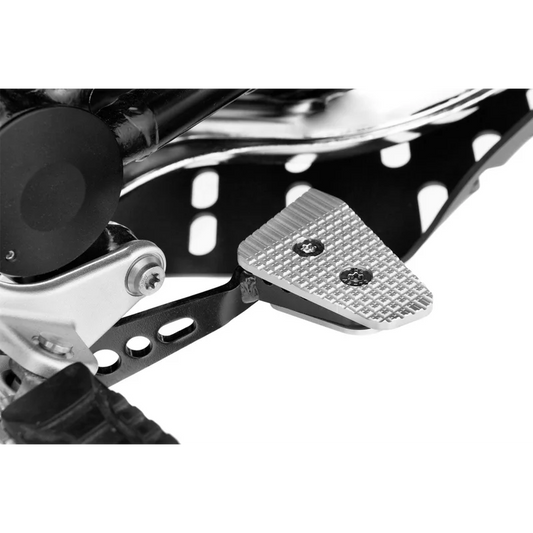 BMW Ergonomics Brake Lever Enlargement, silver machined pedal pad with knurled grip surface mounted on black brake lever arm, close-up showing two hex head mounting screws.